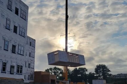 Rendering of a four-story modular apartment building