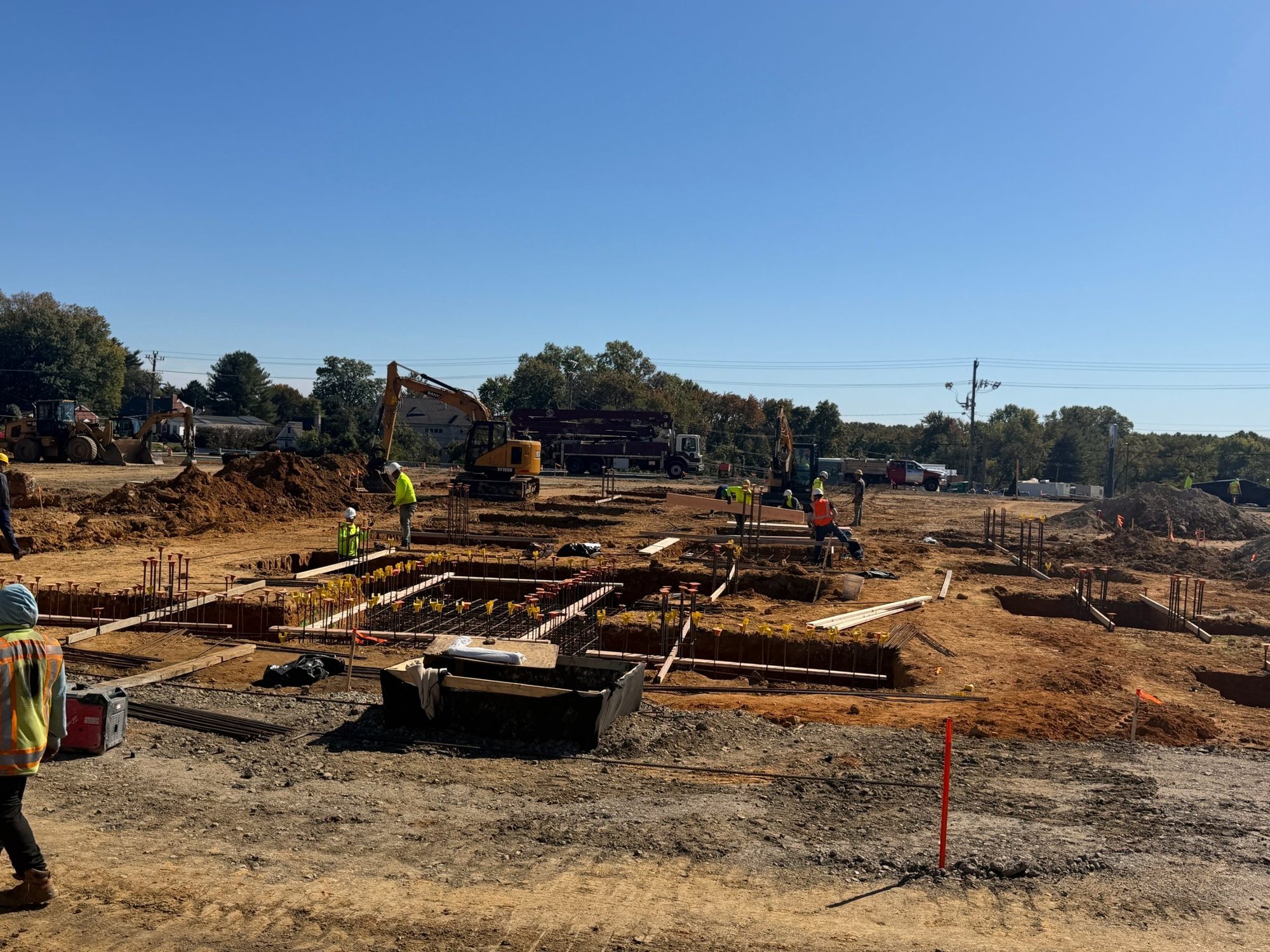 Foundation work underway at Capitol Trail, a seven-building mixed-use community in Newark, Delaware